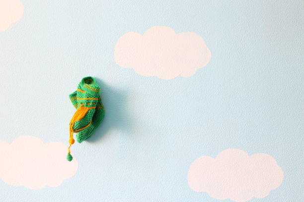 istock Green baby wool socks on the background blue wall 667940148
