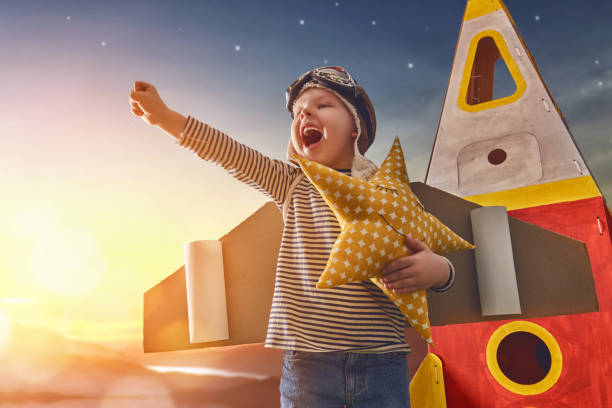 istock Child in astronaut costume 667940354