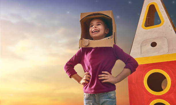 istock Child in astronaut costume 667940444