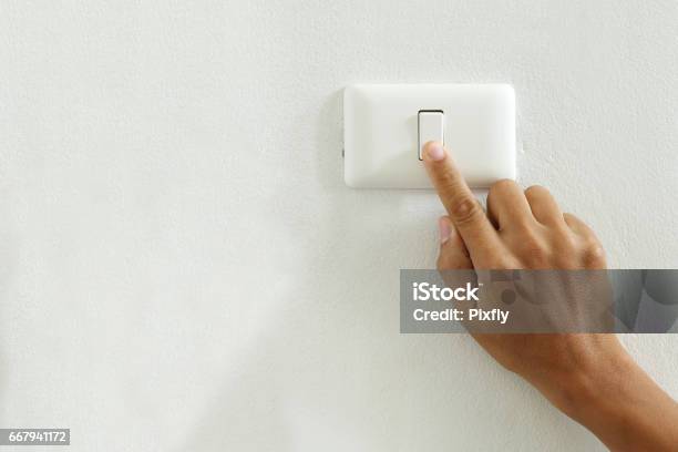 Closeup Of Finger Touching To Electric Switch Off With Copy Space Stock Photo - Download Image Now