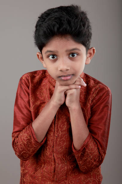 Happy boy of Indian origin wearing a traditional dress