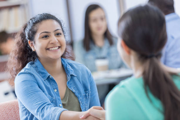 istock Cheerful school counselor with student 667946568