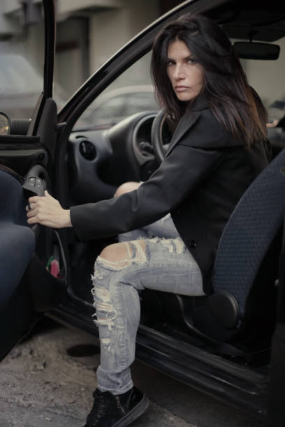 istock Young woman sitting in her car 667946622