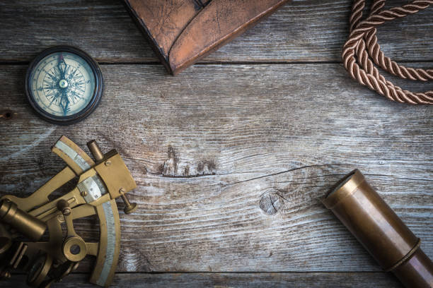 istock compass,sextant and spyglass on the timber 667947694