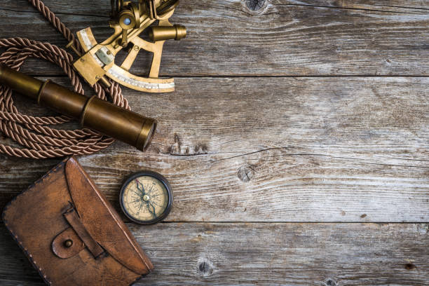 compass,sextant and spyglass on the timber stock photo