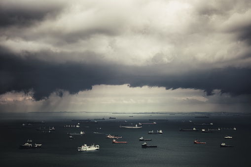 The coming storm and ships in Straits of Singapore from the view point on the Jin Shan Lou (Marina Bay Sands). Singapore