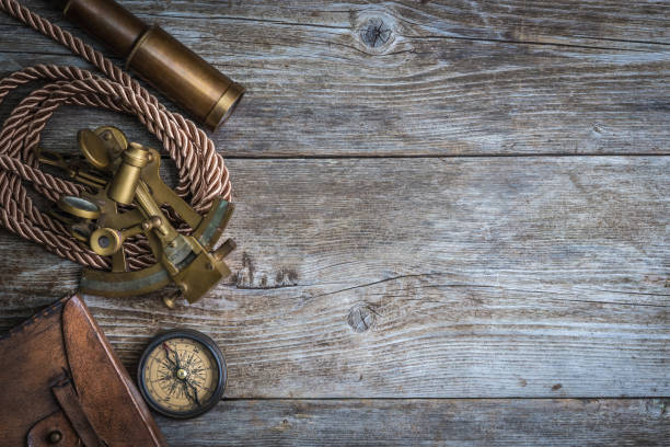 istock compass,sextant and spyglass on the timber 667948172