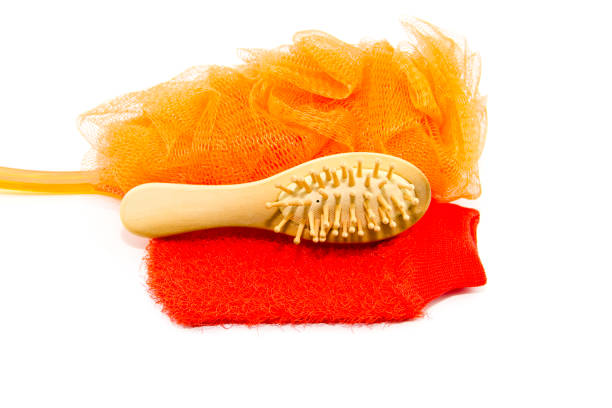 Massage Glove with hairbrush and Netsponge Massage Glove with hairbrush and Netsponge körperpflege stock pictures, royalty-free photos & images