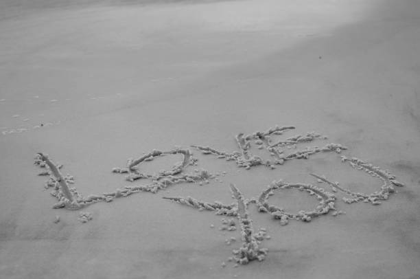 istock LOVE YOU written in sand 667961866