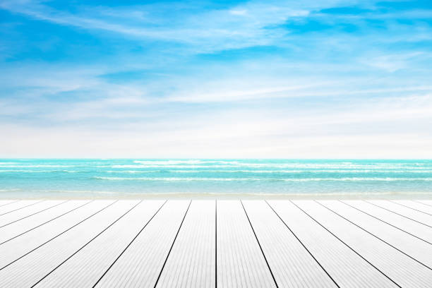Empty wooden table with party on beach background blurred. Concept Summer, Beach, Sea, Relax, Party.