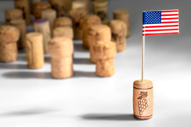 american wine industry with one wine cork bottle stopper with american flag planted in it and multiple corks in background - food and drink industry imagens e fotografias de stock