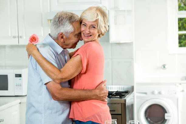 istock Romantic senior couple with rose 667977546