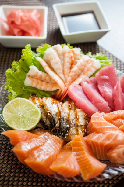 istock Plate with salmon, tuna, shrimps and smoked eel 667978196
