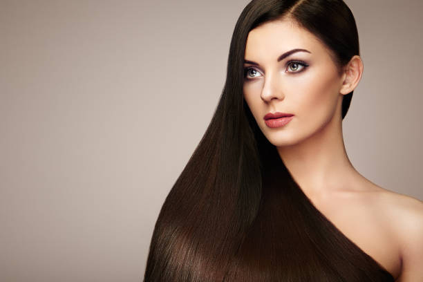 istock Beautiful woman with long smooth hair 667980240