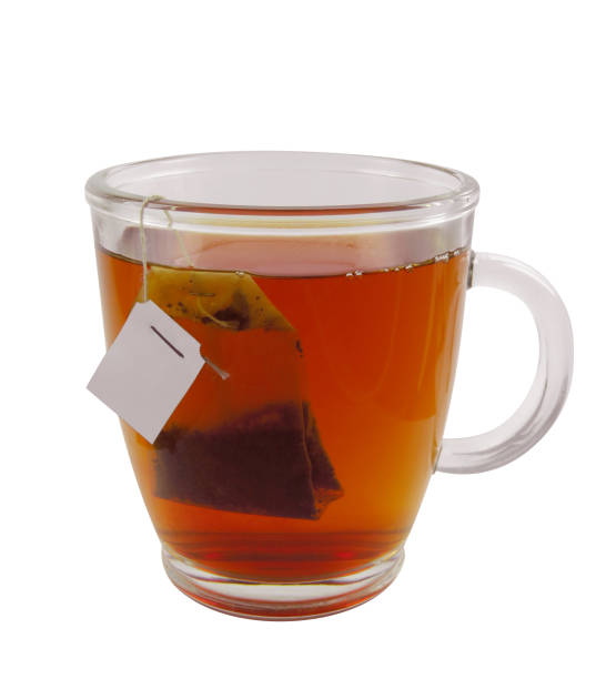 istock Glass teacup with teabag 667984088