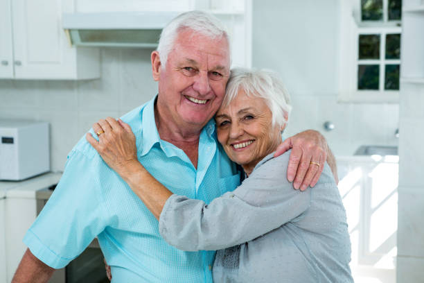 istock Affectionate senior couple embracing at home 667985450