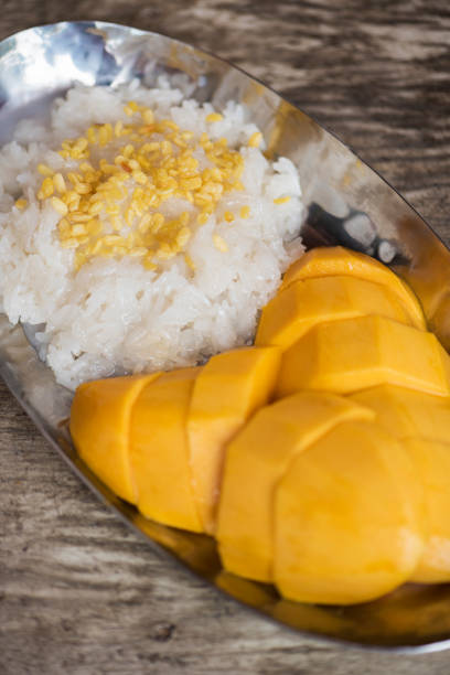 Khao Neaw - Ma Muang, Thai style tropical dessert, sticky rice with mango.