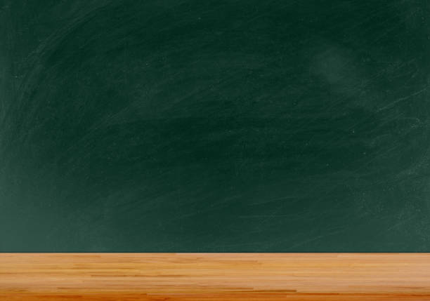 istock Wooden table with texture blank blackboard for background - education background 667988356