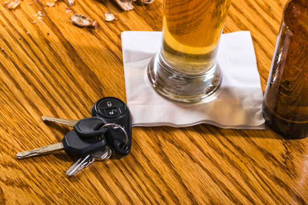 istock Drinking and driving - peanuts, beer and car keys 667994492