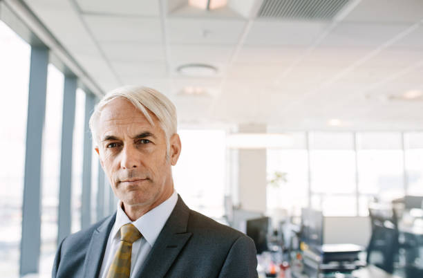 istock Confident mature businessman in office 668002964