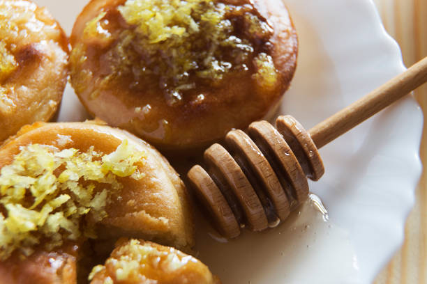 istock Close up of three lemon cakes and honey 668003342