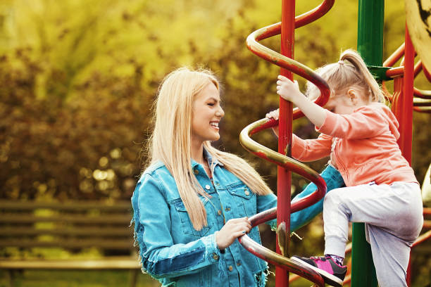istock Mother and Daughter in the Park 668005794