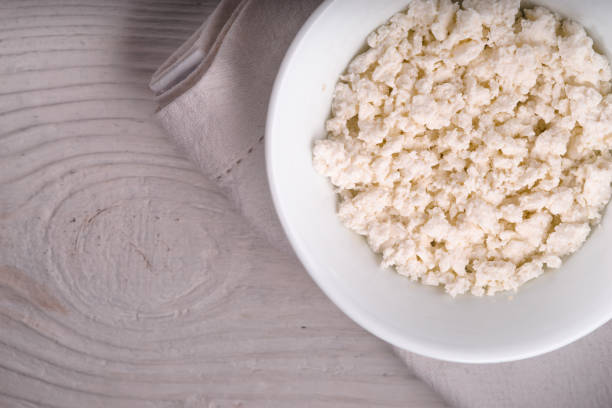 istock Cottage cheese in a ceramic bowl on a white napkin diagonal 668009886