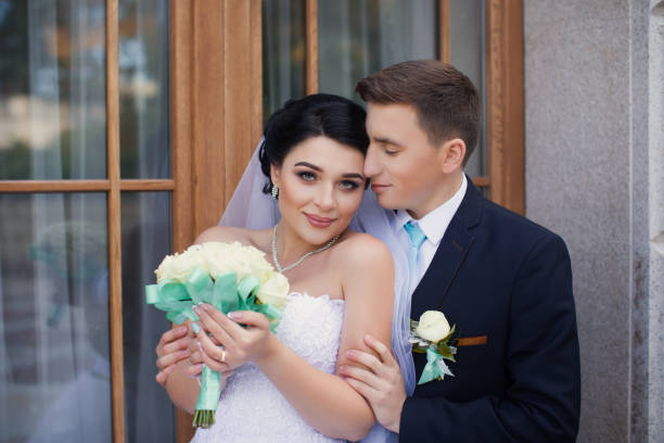 istock The groom tenderly embraced the bride 668010092