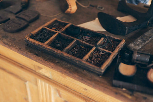 istock Interior with attributes of an old-fashioned shoemaker. 668012244