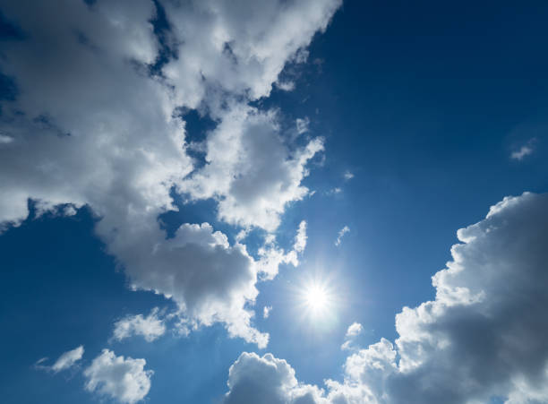 istock blue and very cloudy sky on a sunny day 668017164