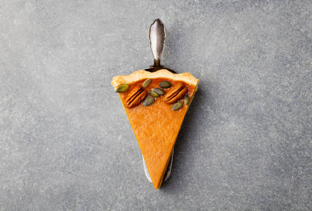 istock Pumpkin pie, tart made for Thanksgiving day. Grey stone background. Top view 668025710