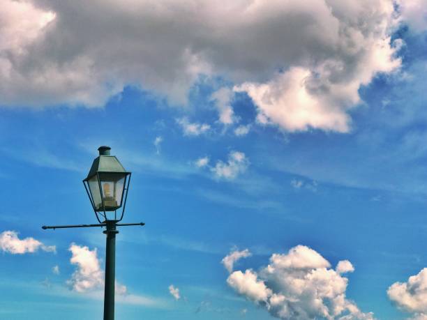 istock City street light with sky - clouds 668027286