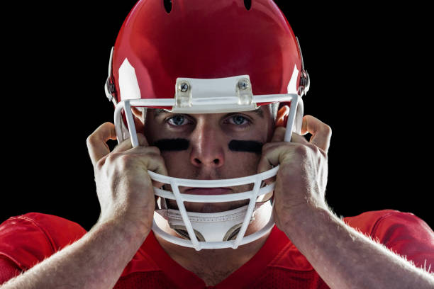 istock American football player looking at camera 668030232
