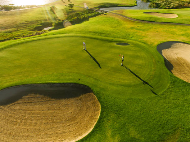 istock Players on a green golf course 668031158