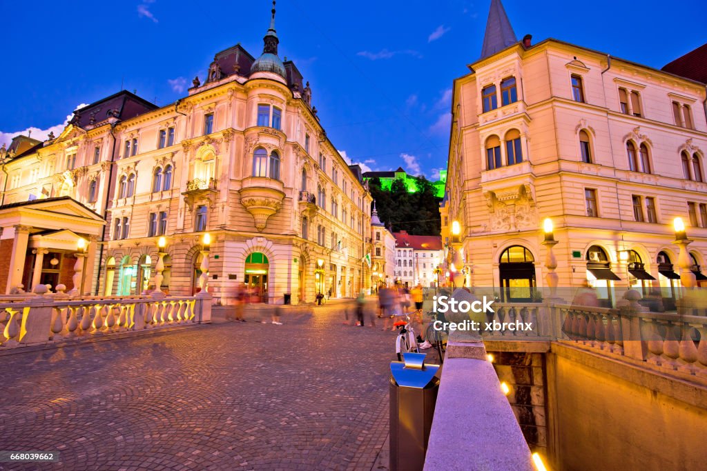 Tromostovje bridge, old town and square evening view, Ljubljana, capital of Slovenia Castle Stock Photo