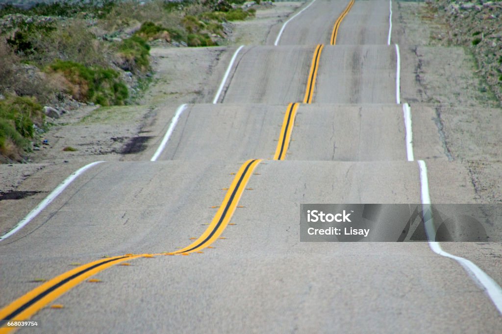 Bumpy Road A road with lots of ups and downs and bumps. Bumpy Stock Photo