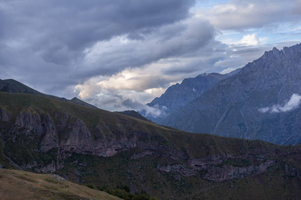 istock ountain panoramic view on a evening. Beautiful evening mountain landscape under bright sunset. Georgia Kazbegi 668040348