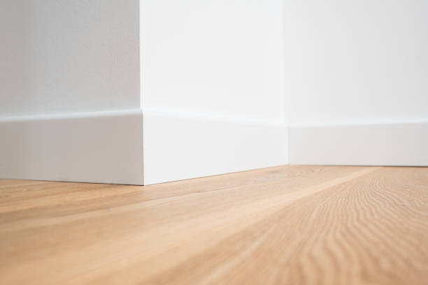 wooden floor parquet and white walls stock photo