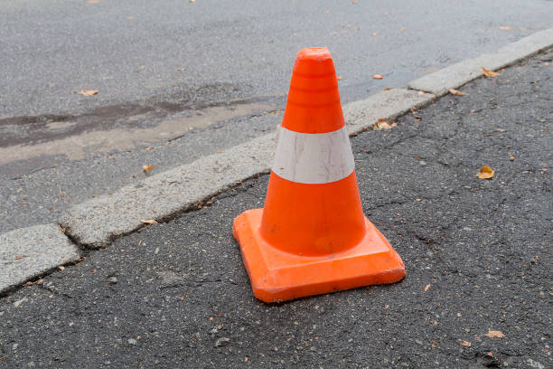 istock Striped orange cones on the asphalt road 668064192