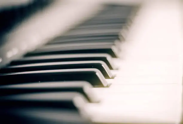 Close-up photo of a vintage piano keys.