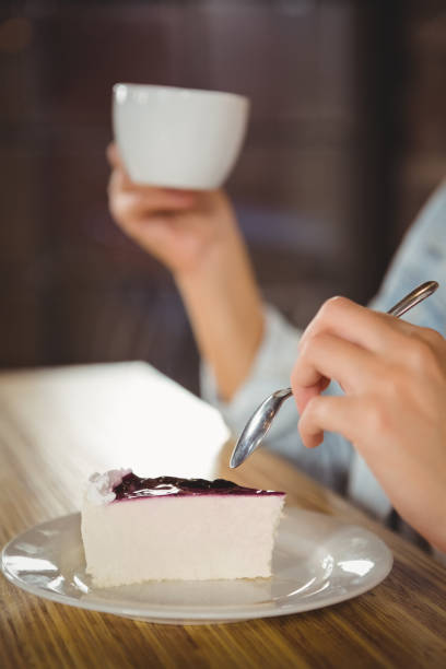 istock Woman enjoying cake and coffee 668067034