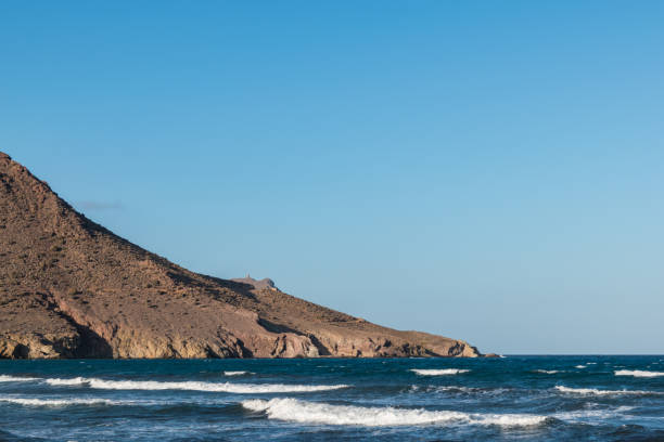 istock mountains by the sea coastline 668067612