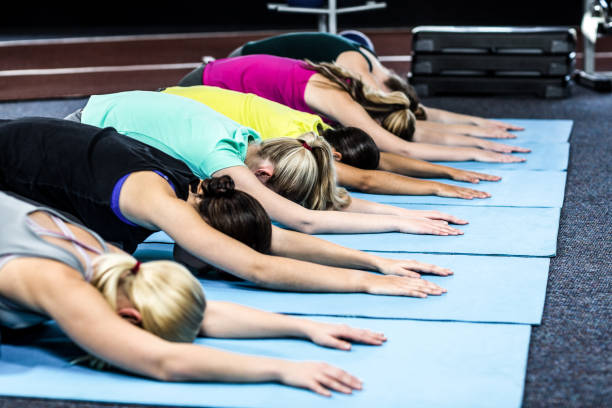 istock Fitness class doing yoga exercises 668067852