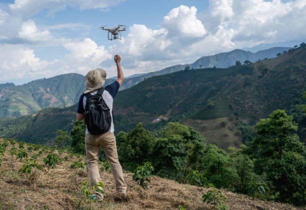 istock Man flying a drone in the countryside 668076758
