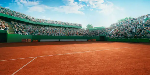 Tennis stadium with crowd on the bleachers.