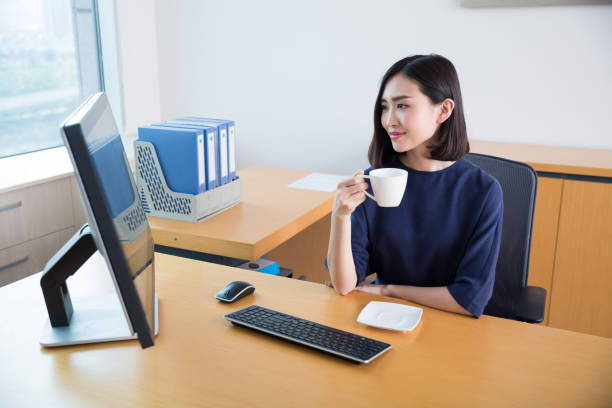 istock young beautiful girl,sitting in the office began her work 668087308