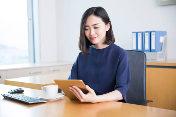 istock young beautiful girl,sitting in the office began her work 668087426