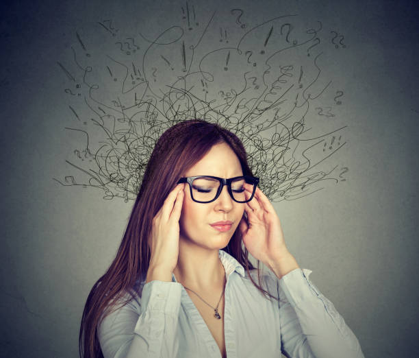 istock stressed young business woman having headache 668087646