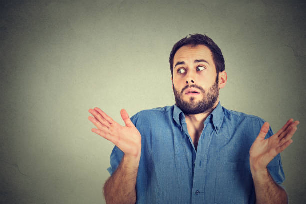istock young man shrugging shoulders who cares so what I don't know gesture 668093290