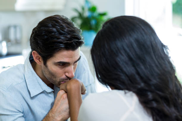 istock Young man kissing a woman on hand 668096430